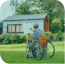 Perth lawyer assists with wills, estates, probate, and letters of administration. An artist in a wheelchair painting a picture outdoors.