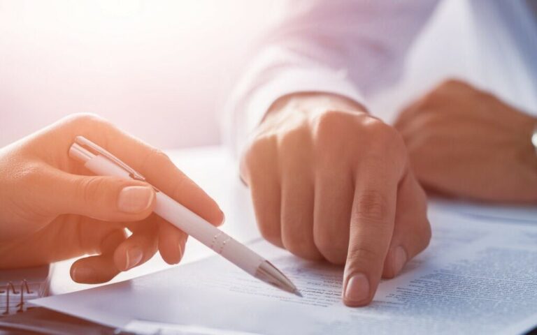 Negotiating contract in Perth. Business people reviewing commercial law documents, estate planning, wills, estates, probate with Clairs Keeley Lawyers.
