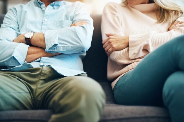 Angry couple sitting apart, a metaphor for divorce, handled by Clairs Keeley Lawyers in East Perth. Relationship advice and family law.