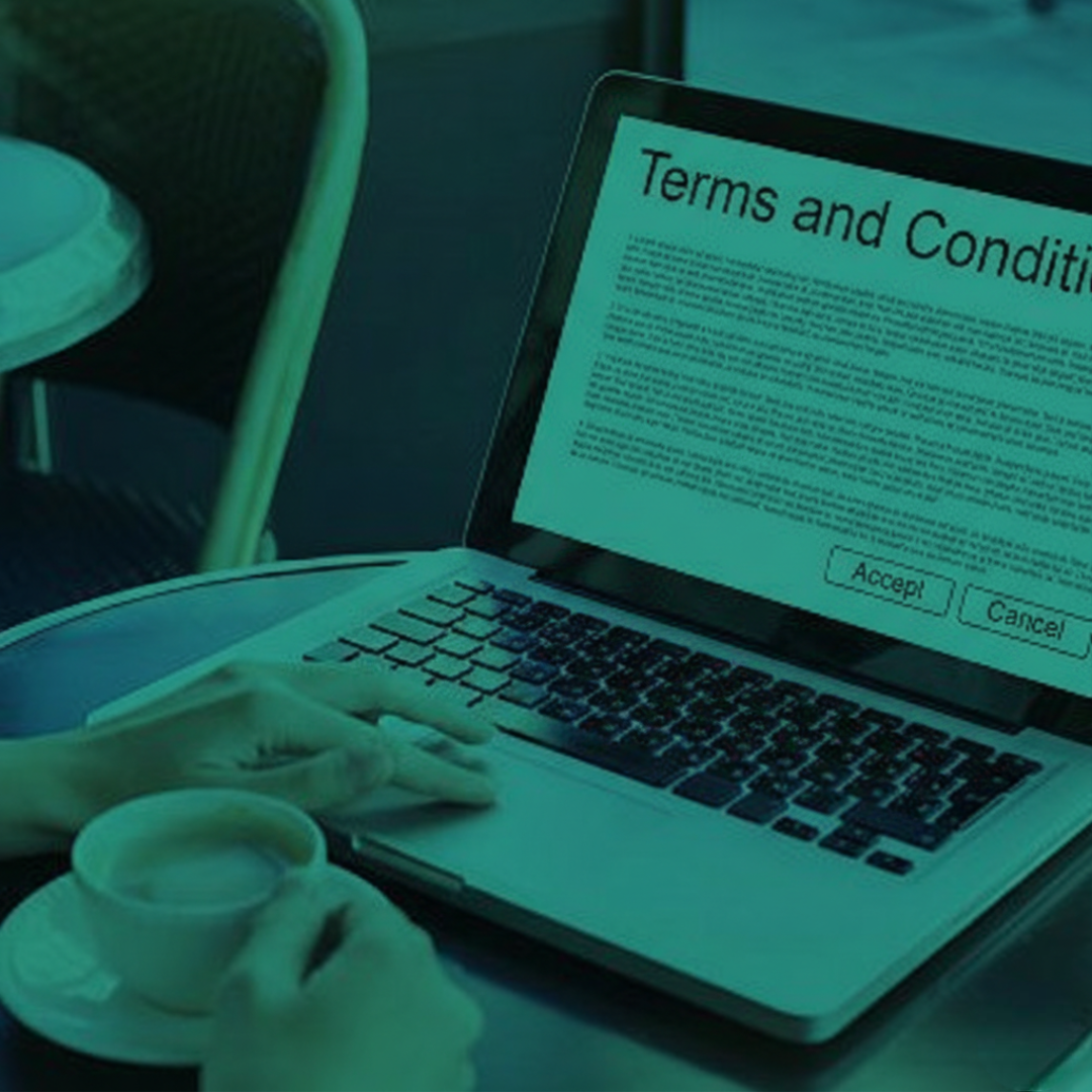 Laptop showing terms and conditions with accept/cancel buttons, linking to Wills and Estate Planning services in Perth at Clairs Keeley Lawyers.