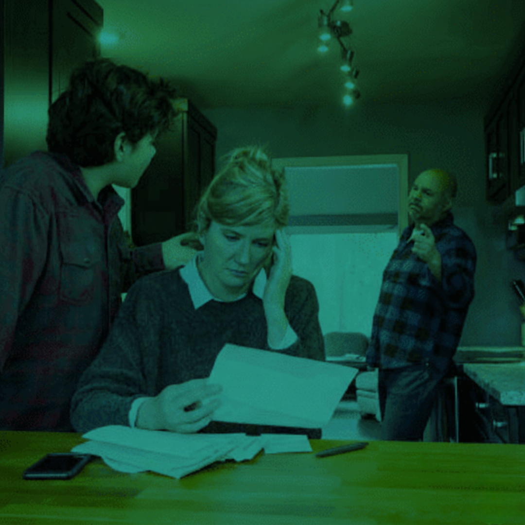 Family Law: Woman distressed, reading documents, domestic tension in Perth. Clairs Keeley Lawyers, expert legal help for family, violence issues.