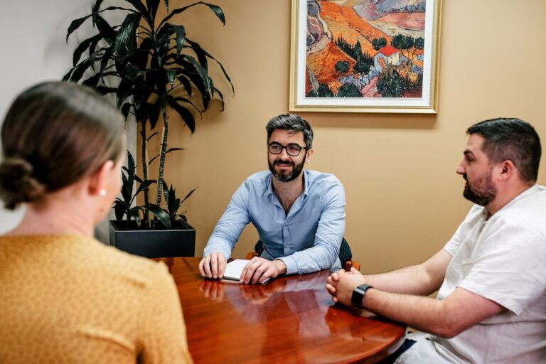 Mediation Meeting: People discussing at table in East Perth at Clairs Keeley Lawyers. Family & Commercial Law, Wills, Estates, Discussion.