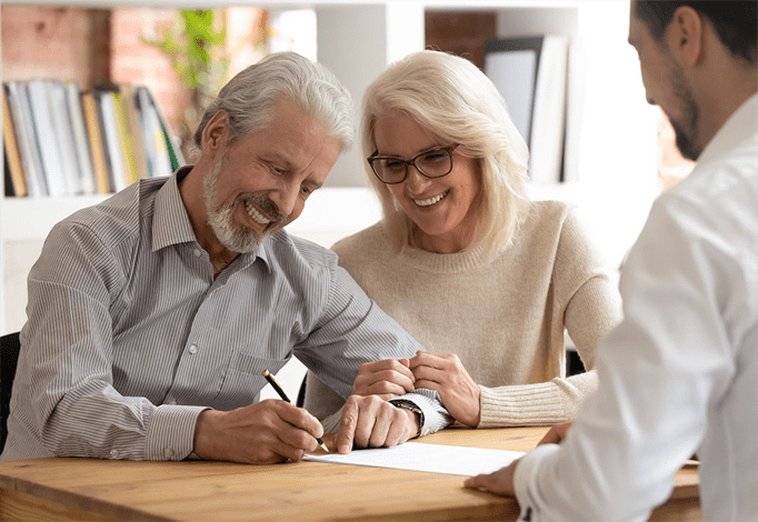 Mediation signing in Perth. Senior couple at Clairs Keeley Lawyers, East Perth, signing agreement. Family & Commercial law, Wills, Estates.