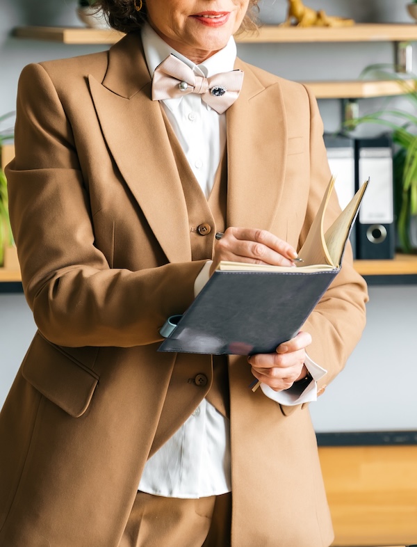 Perth lawyer specializing in Wills & Estates writing in a notebook. Estate planning services at Clairs Keeley Lawyers, expert legal advice.