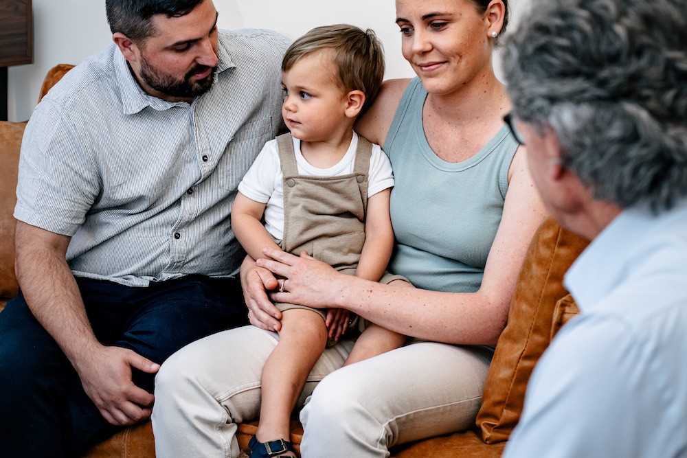 Family meeting at Clairs Keeley Lawyers Perth, featuring parents and child in consultation. Parenting and legal advice for your first meeting