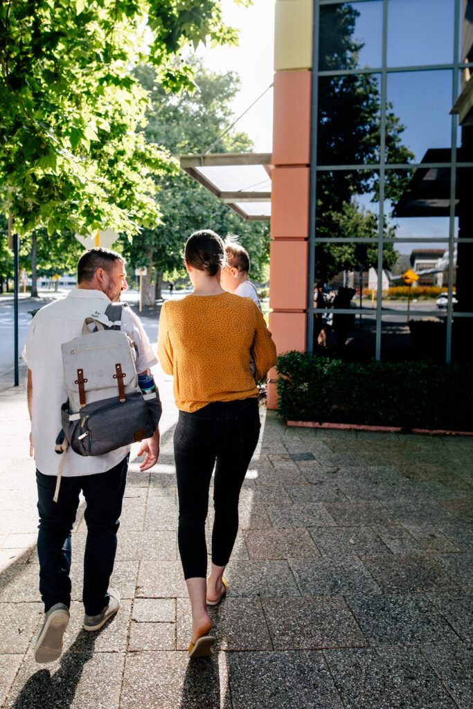 Family walking on a street in Perth, Western Australia. Clairs Keeley Lawyers support families with child support & family law matters in Perth.