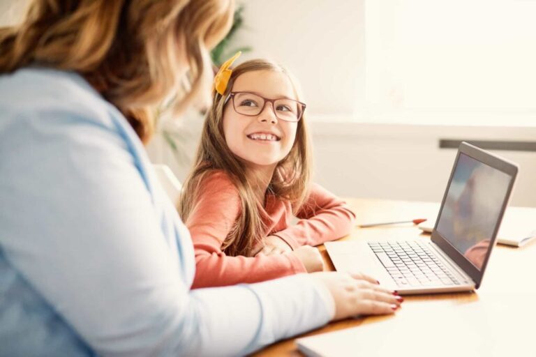 Child Support Perth: Mother and daughter using laptop. Clairs Keeley Lawyers support families. Legal services for children's wellbeing.
