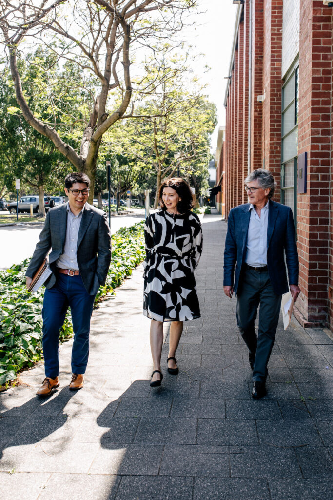 Clairs Keeley Lawyers Perth: Business conversation on sidewalk. Expect expert legal advice for Family & Commercial Law, Estate Planning.