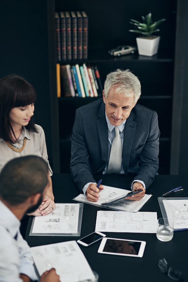 Clairs Keeley Lawyers Perth meeting discussing Wills & Estates planning, reviewing documents. Legal expertise in Perth for estate matters.