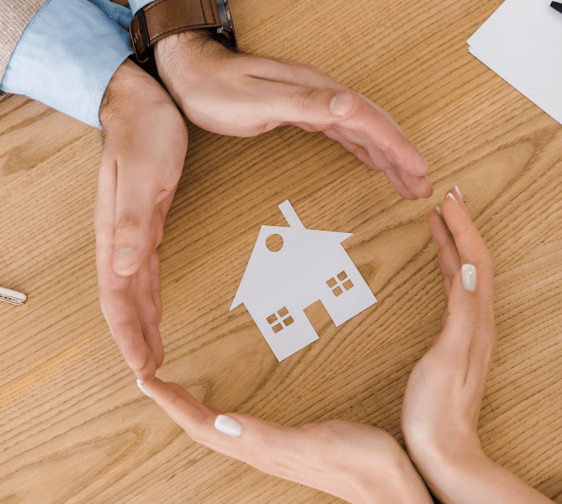 Perth Deceased Estates: Hands protect paper house. Clairs Keeley Lawyers offer advice on estate administration.